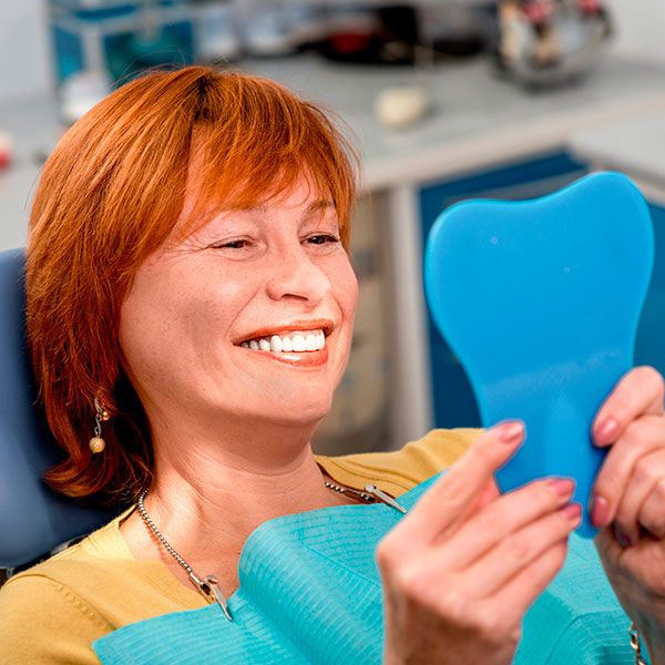 Woman in the dental office - Advanced Prosthetics Ltd
